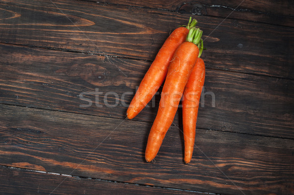 Fresh carrots bunch on rustic wooden background Stock photo © voloshin311