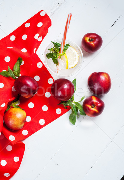 Cold fresh lemonade and nectarines on wood background Stock photo © voloshin311