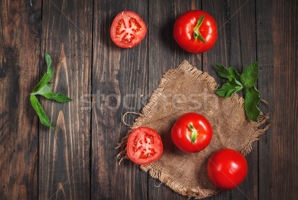 Close-up of fresh, ripe tomatoes on wood background Stock photo © voloshin311