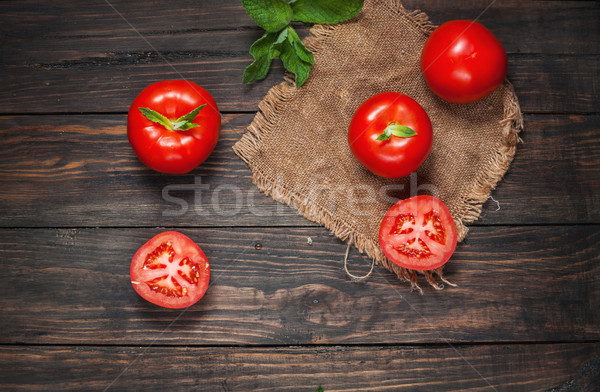 Close-up of fresh, ripe tomatoes on wood background Stock photo © voloshin311