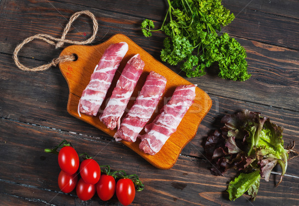 Bacon rolls with tomato, parsley on wooden background Stock photo © voloshin311