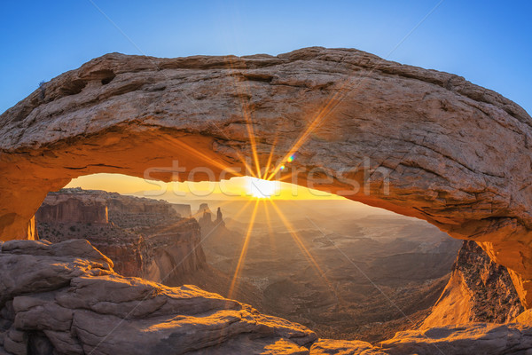 Famous sunrise at Mesa Arch Stock photo © vwalakte