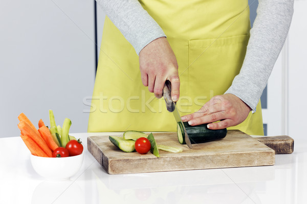 Cutting cucumber Stock photo © vwalakte