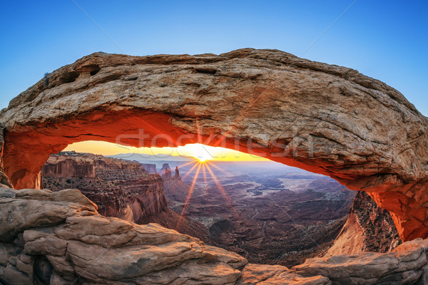 Famous sunrise at Mesa Arch Stock photo © vwalakte
