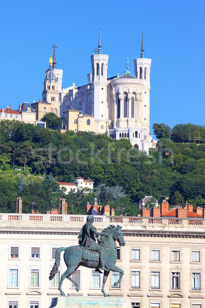 Statue of Louis XIV and basilica Stock photo © vwalakte