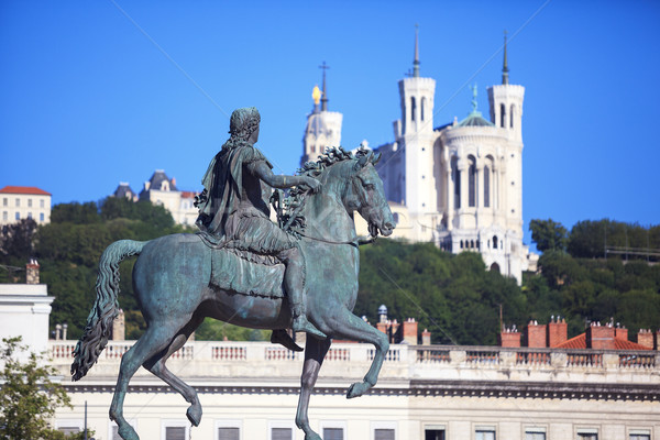 Famous statue of Louis XIV and Basilique of Notre Dame de Fourvi Stock photo © vwalakte