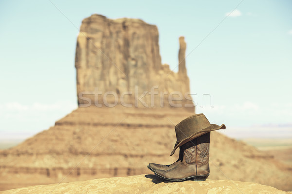 Boots and hat in front of Monument Valley Stock photo © vwalakte