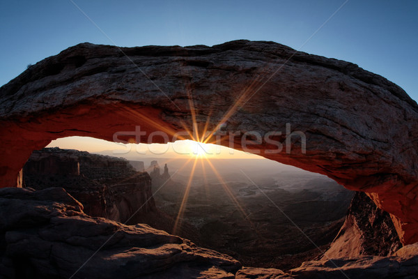 the famous Sunrise at Mesa Arch Stock photo © vwalakte