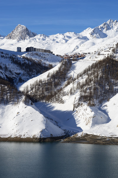 Stock photo: Tignes village in winter with lake