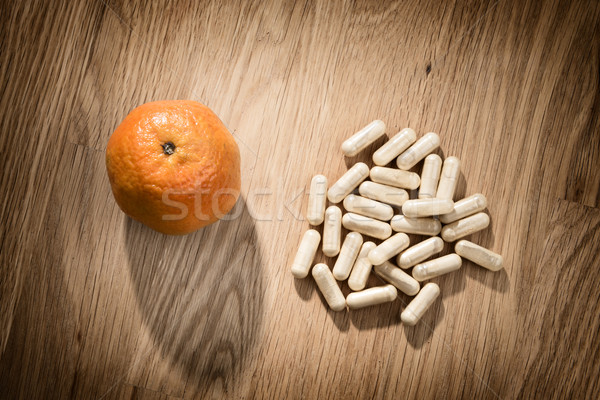 fruit and pills on table Stock photo © w20er