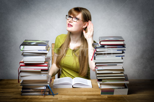 Listening female student with books Stock photo © w20er
