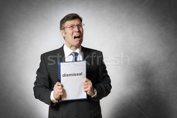 Business man with dismissal Stock photo © w20er