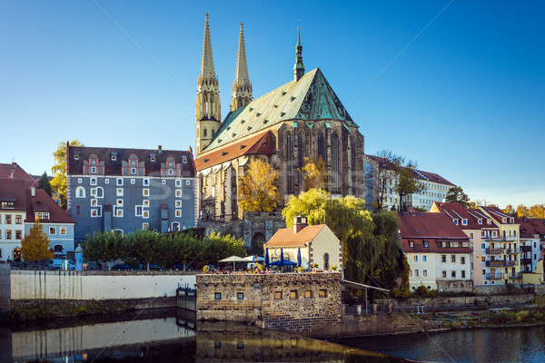 Stockfoto: Kerk · huizen · rivier · najaar