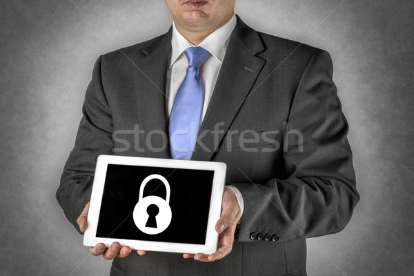 Businessman with tablet computer and padlock Stock photo © w20er