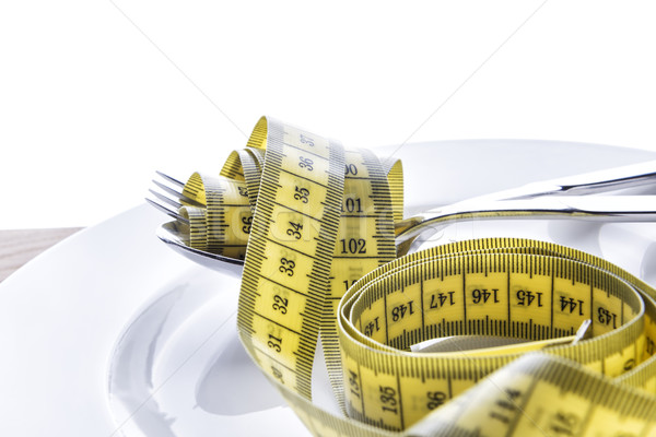 Tape measer with fork and spoon Stock photo © w20er