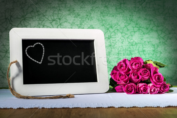 slate blackboard with heart and roses Stock photo © w20er