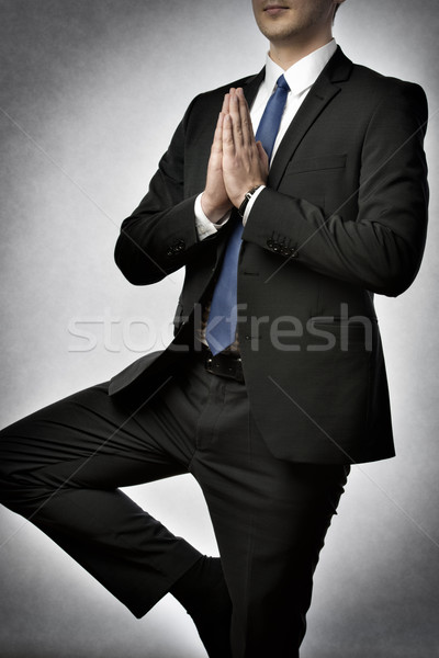 Stock photo: Businessman doing yoga