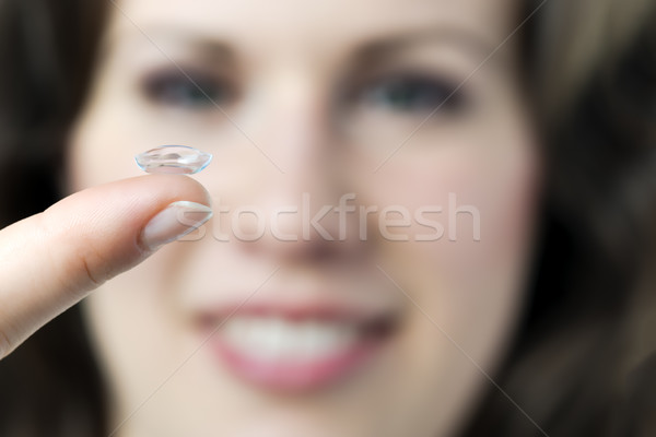 Woman with contact lense Stock photo © w20er