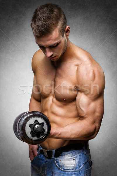 Atléta súlyzó fiatalember kút képzett test Stock fotó © w20er