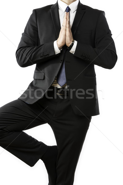 Businessman performs a yoga exercise Stock photo © w20er