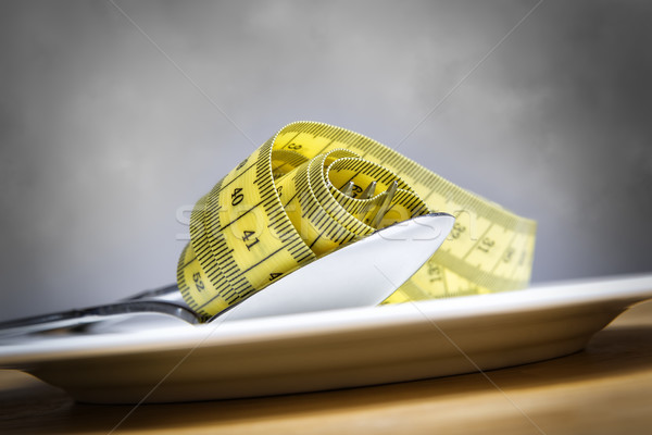 Tape measer with fork and spoon Stock photo © w20er
