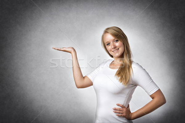 Stock photo: Woman presenting something