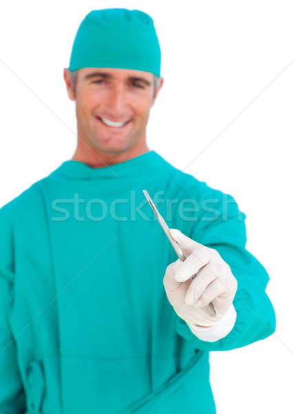 Durchsetzungsfähig Chirurg halten Stethoskop Skalpell weiß Stock foto © wavebreak_media