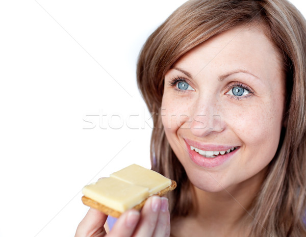 Cheerful woman eating a cracker with cheese  Stock photo © wavebreak_media