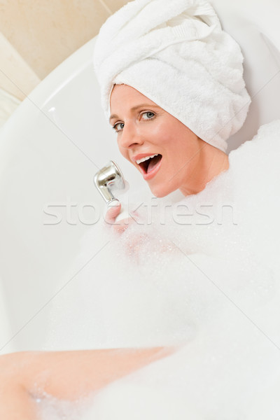 Charming woman taking a bath with a towel on her head Stock photo © wavebreak_media