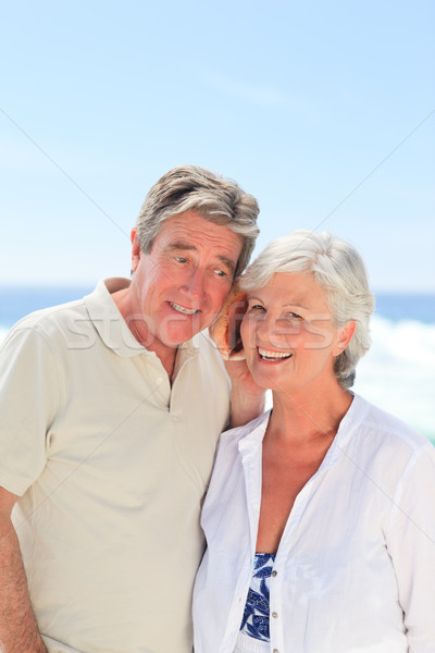 Emekli çift dinleme kabuk kadın plaj Stok fotoğraf © wavebreak_media