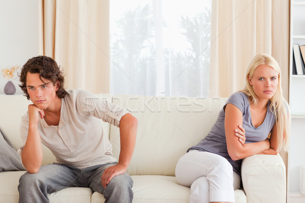 Sorrowful couple sitting on a sofa not looking at each other Stock photo © wavebreak_media