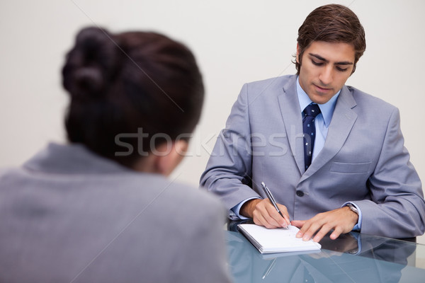 Fiatal üzletember megbeszélés jegyzetel üzlet beszél Stock fotó © wavebreak_media