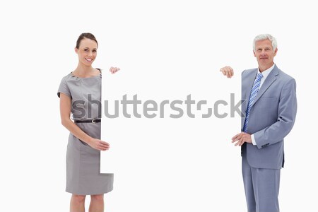 White hair businessman holding a big white sign with a woman against white background Stock photo © wavebreak_media