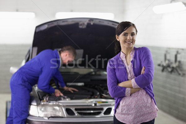 Front view of a client looking at camera in a garage Stock photo © wavebreak_media