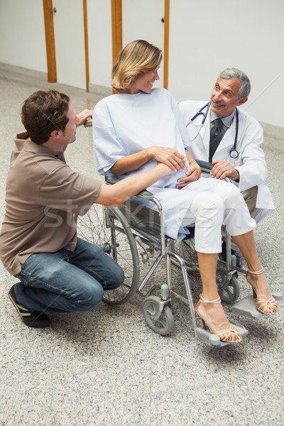 Doctor talking to pregnant woman in the corridor of the hospital  Stock photo © wavebreak_media