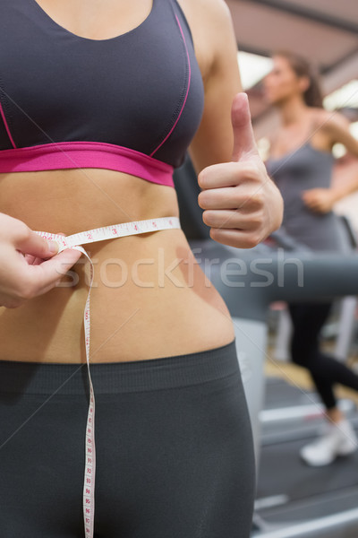 Close up of measuring womans waist in the gym Stock photo © wavebreak_media