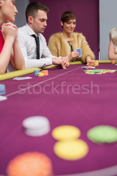 Woman placing bet at poker game in casino Stock photo © wavebreak_media