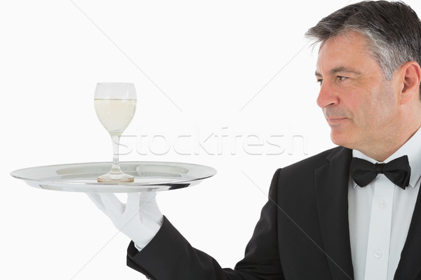 Man serving glass of white wine on silver tray Stock photo © wavebreak_media