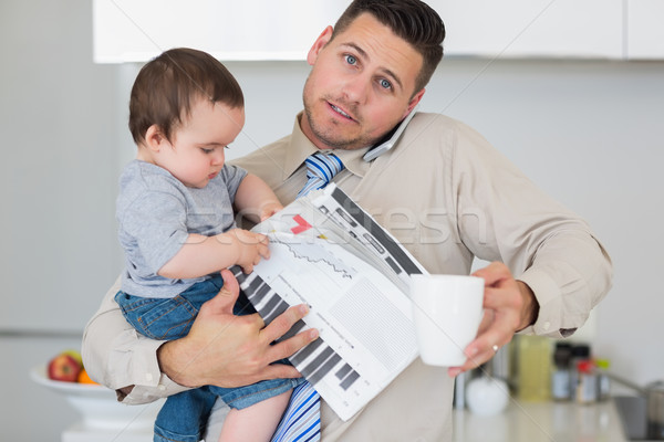 Portrait of father multi tasking in house Stock photo © wavebreak_media