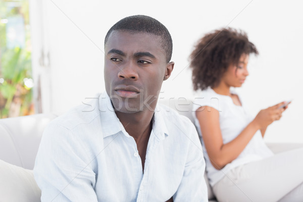 Attractive couple having an argument on couch Stock photo © wavebreak_media
