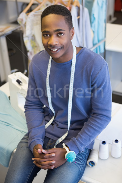Smiling university student sitting with meter Stock photo © wavebreak_media
