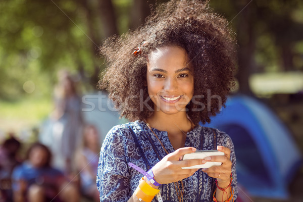 Stock photo: Pretty hipster sending text message