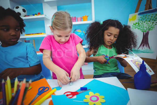 Stock photo: Happy kids doing arts and crafts together