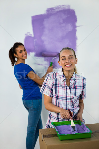 Friends painting a wall Stock photo © wavebreak_media