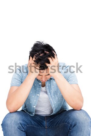 Frustrated man sitting with his hands on head Stock photo © wavebreak_media