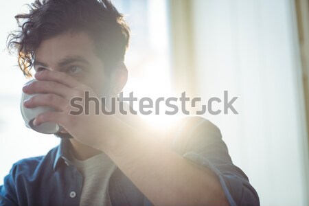 Man drinking coffee at cafe Stock photo © wavebreak_media