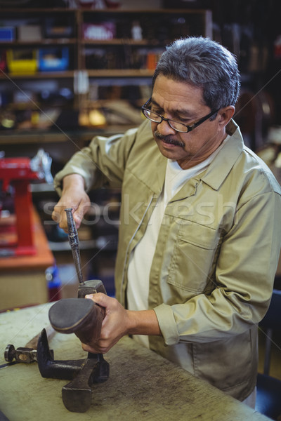 Shoemaker hammering on a shoe Stock photo © wavebreak_media