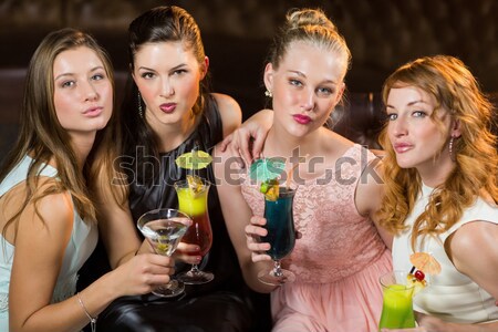 Female friends holding glasses of cocktail in bar Stock photo © wavebreak_media
