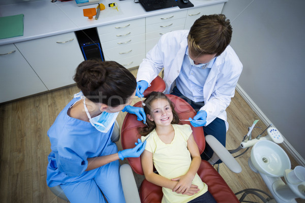 Dentists examining a young patient Stock photo © wavebreak_media