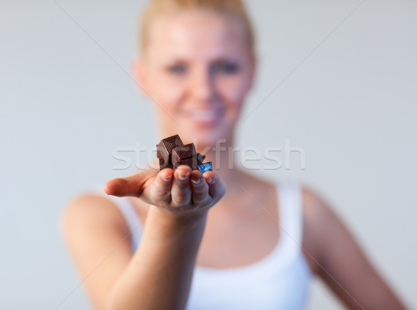 Portrait of a woman holding chocolate focus on chocolate  Stock photo © wavebreak_media